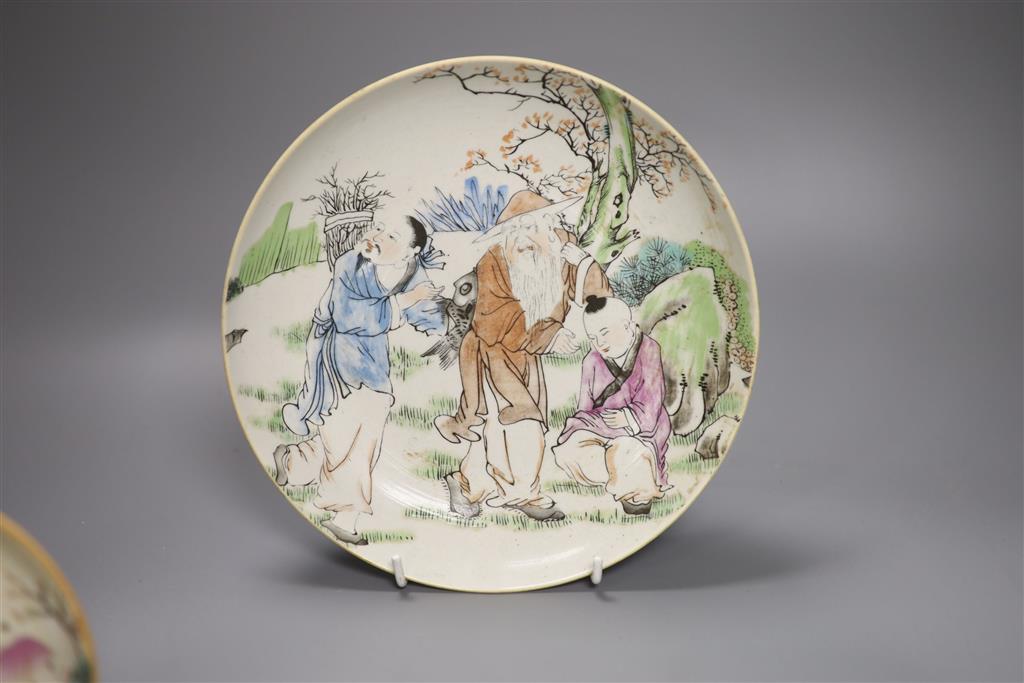 A large Chinese famille rose saucer dish and two similar small dishes, diameter of largest 22.5cm